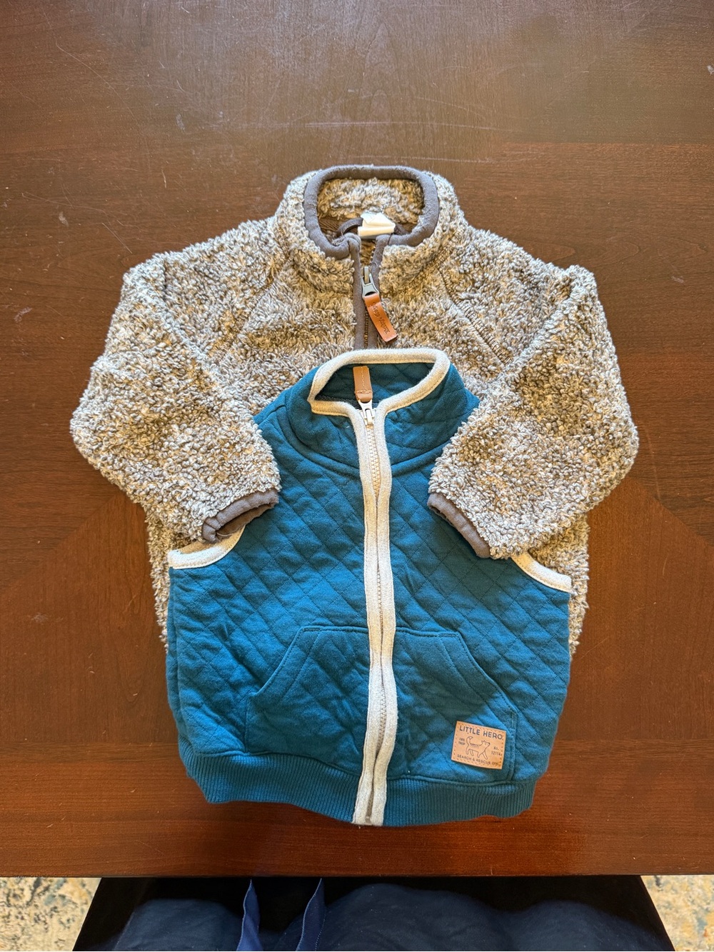 Little Hero blue quilted vest and H&M winter jacket.